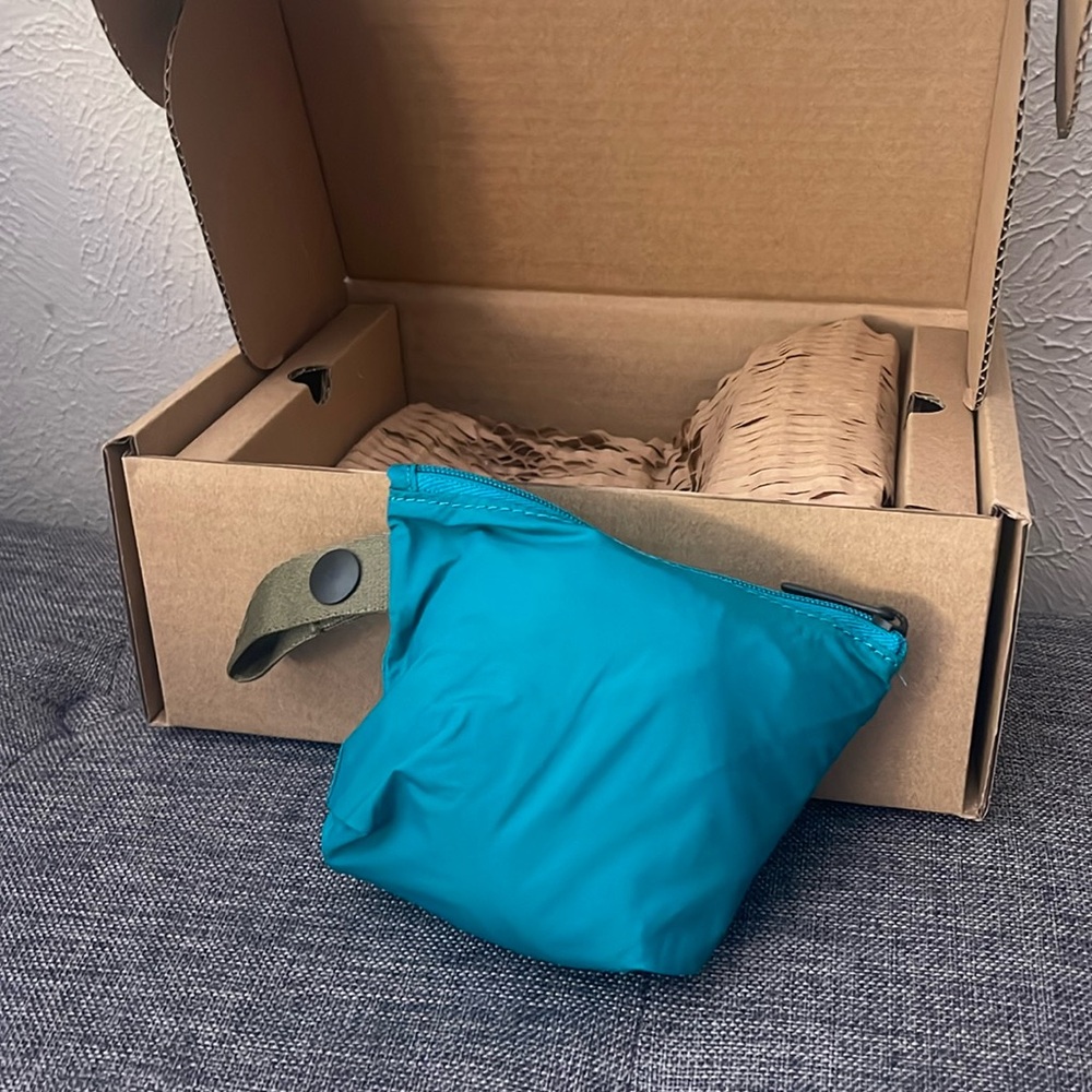 Away. The Packable Sling Bag. NWT. Teal. Over the shoulder bag. Inside pocket.